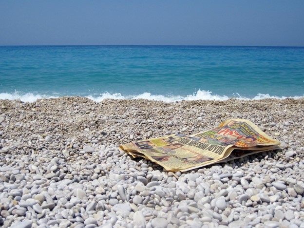 newspaper on beach